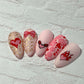 set-of-nail-tips-with-stunning-layered-nail-art-designs-of-hearts-lips-and-bows