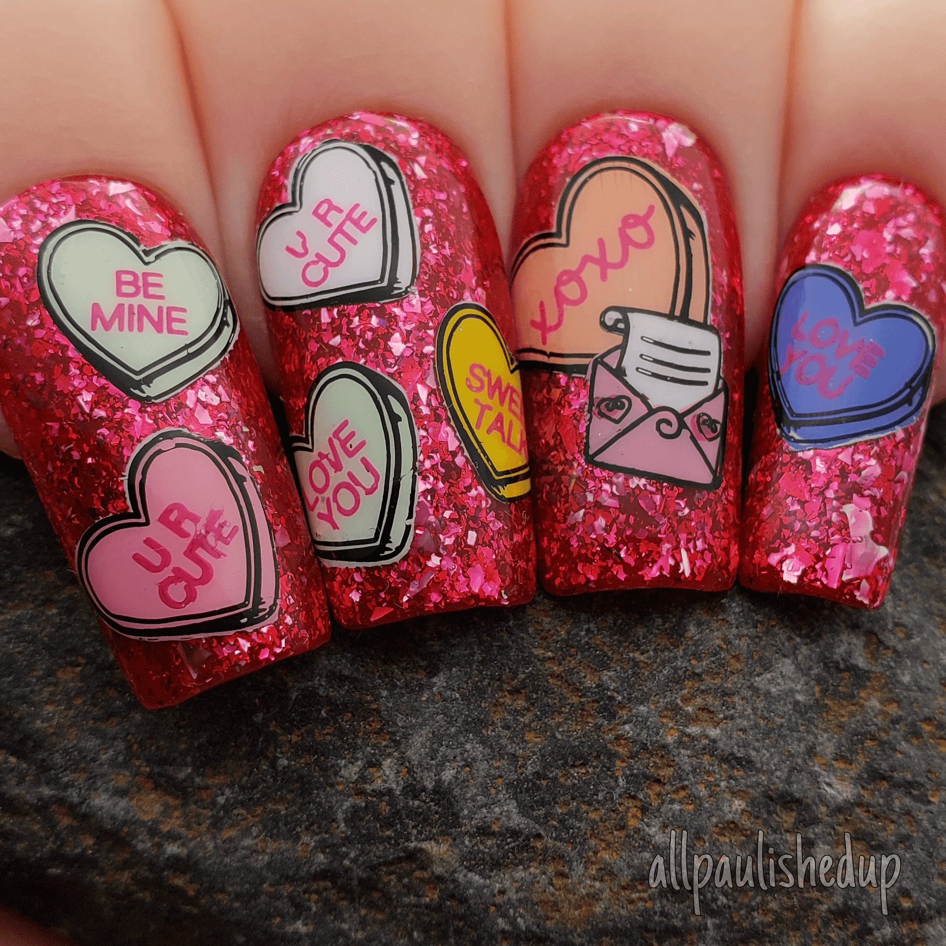 shimmery-manicure-showing-nail-art-designs-of-candy-hearts-and-a-love-letter