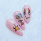 set-of-three-nail-tips-with-nail-art-designs-of-a-diamond-ring-rainbow-and-words-marry-me