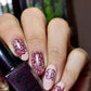 manicured-hand-holding-stamping-polish-with-lace-nail-art-designs