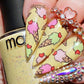 manicured-hand-with-bright-nail-art-designs-of-ice-cream-cones-with-hearts-on-top