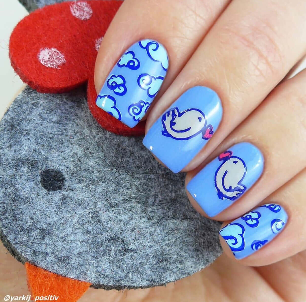 bright-manciure-showing-nail-art-designs-of-clouds-and-birds-holding-hearts-in-their-beaks