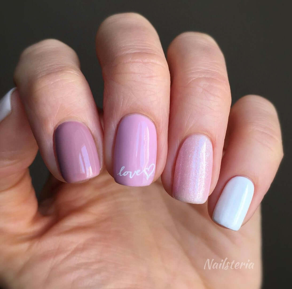 manicured-hand-with-the-words-love-and-a-heart-shape-in-nail-art-designs