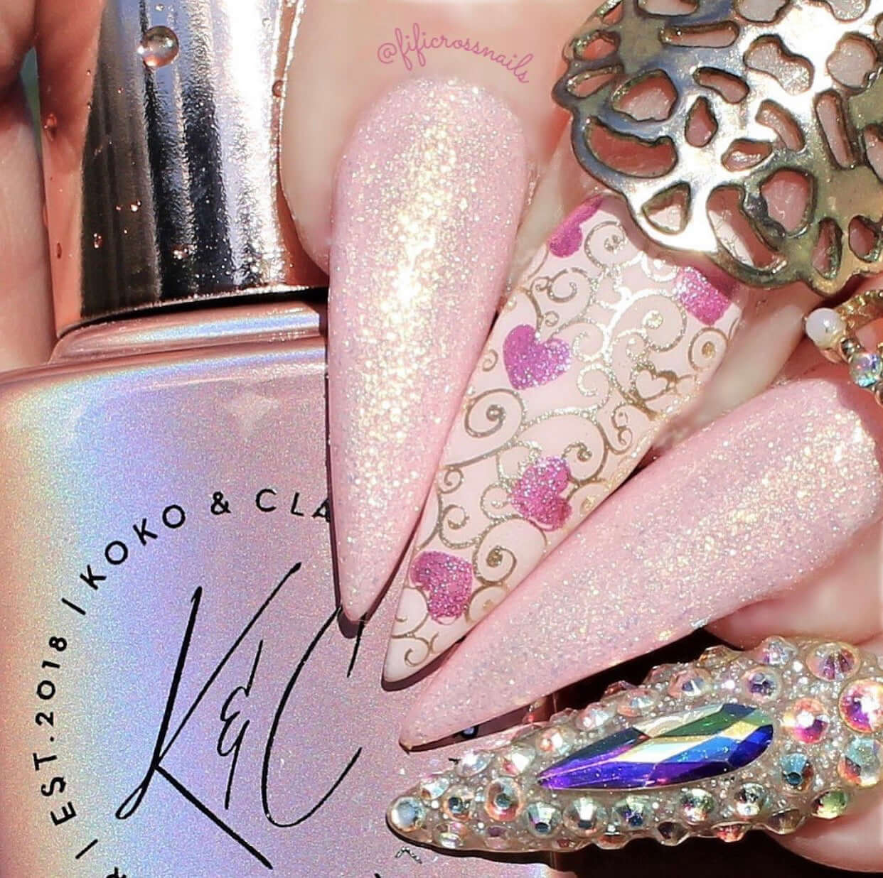 gorgeous-shimmery-manicure-with-a-swirly-heart-nail-art-design