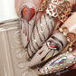 Manicure-showing-nail-art-designs-of-a-heart-dripping-blood-an-eye-crying-blood-and-barbwire