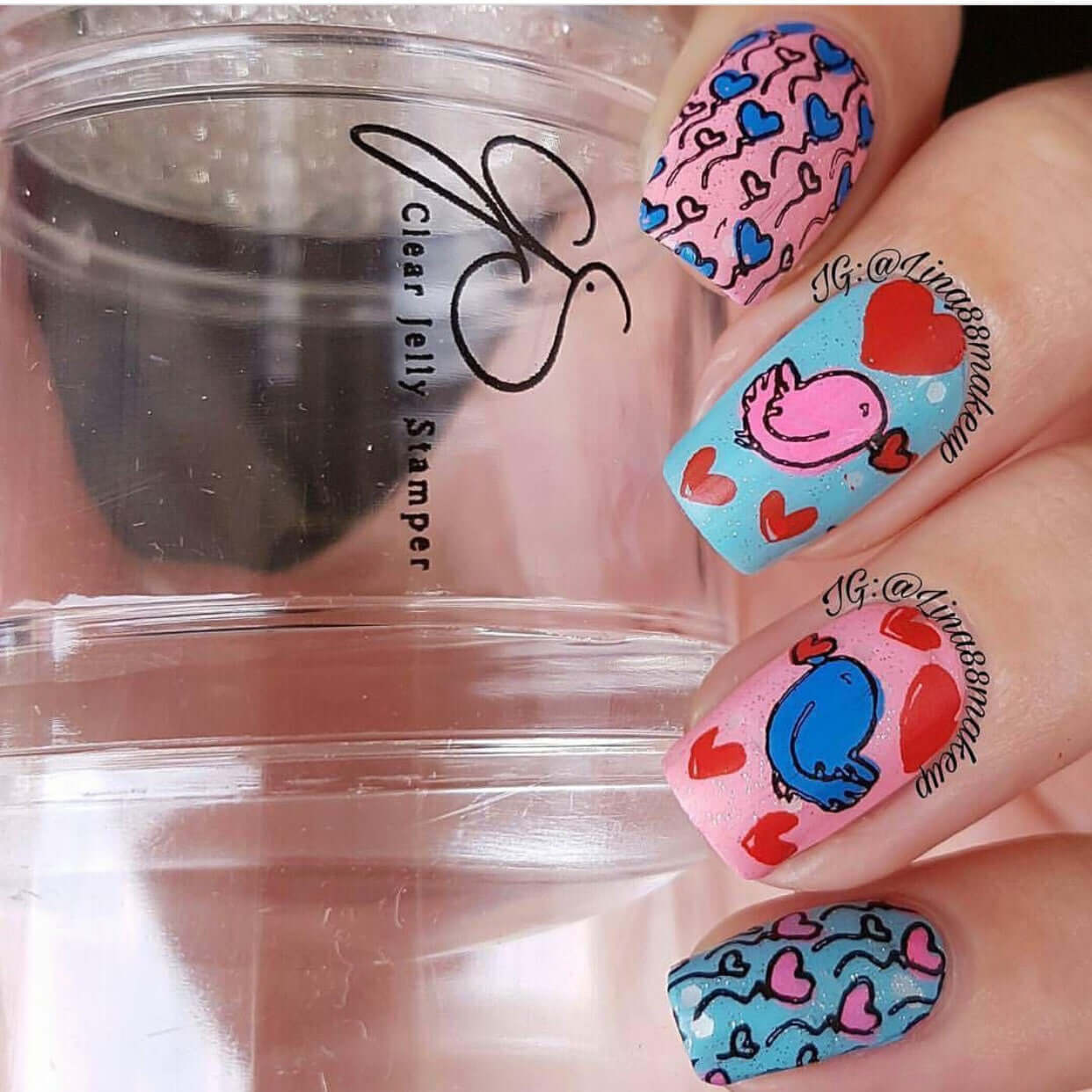 bright-manicure-with-valentine's-themed-nail-art-of-heart-balloons-and-birds-holding-hearts