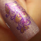 single-manicured-nail-showing-layered-nail-art-designs-of-swirly-hearts