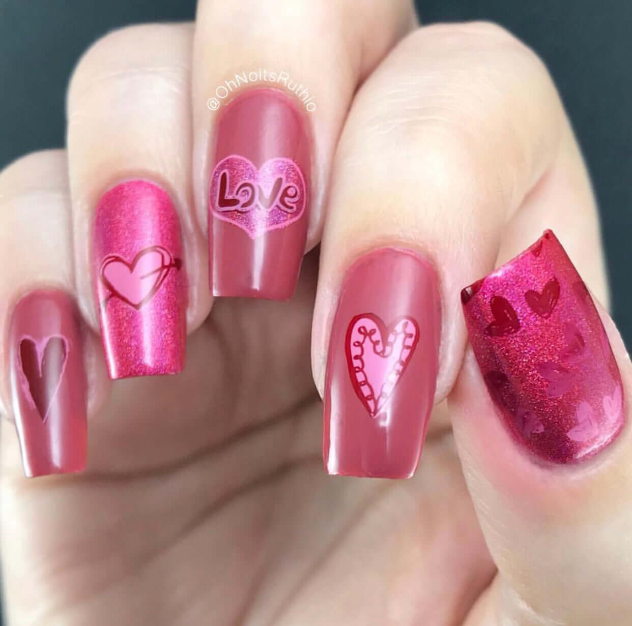 shimmery-manicure-with-nail-art-designs-of-hearts-and-the-words-love