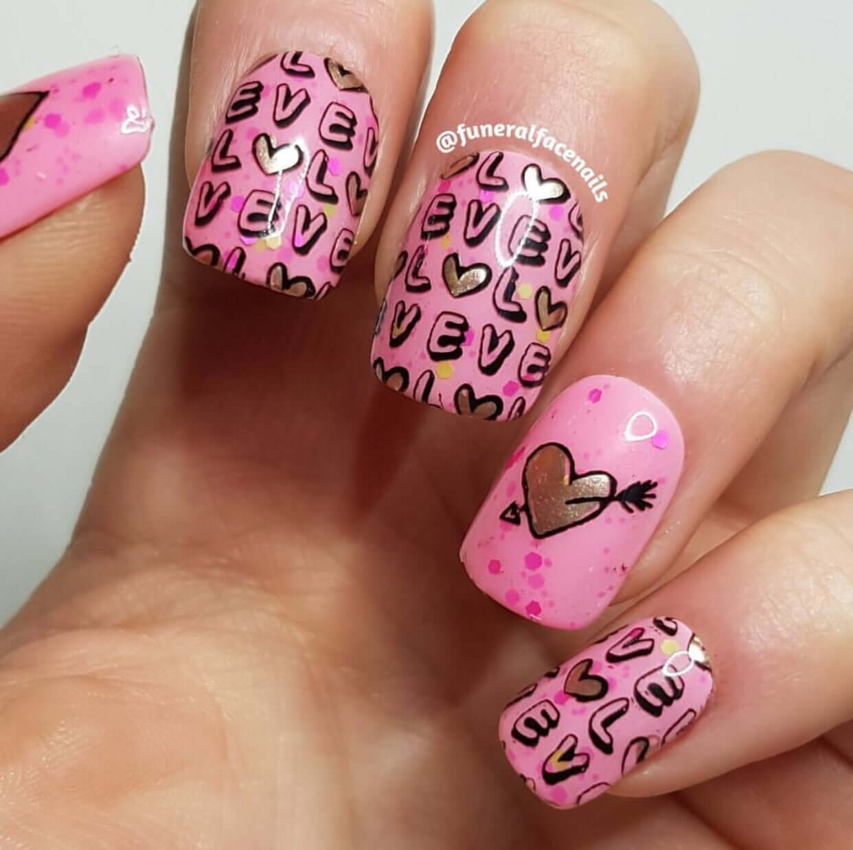 stunning-manciure-with-nail-art-design-of-a-heart-with-an-arrow-through-it-and-words-love