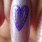 single-manicured-nail-showing-layered-nail-art-designs-of-swirly-heart